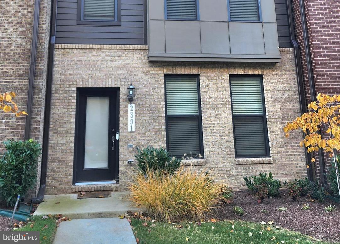 2391 Liberty Loop Herndon, VA 20171 - Photo 1 of 29 a front view of a house with garden