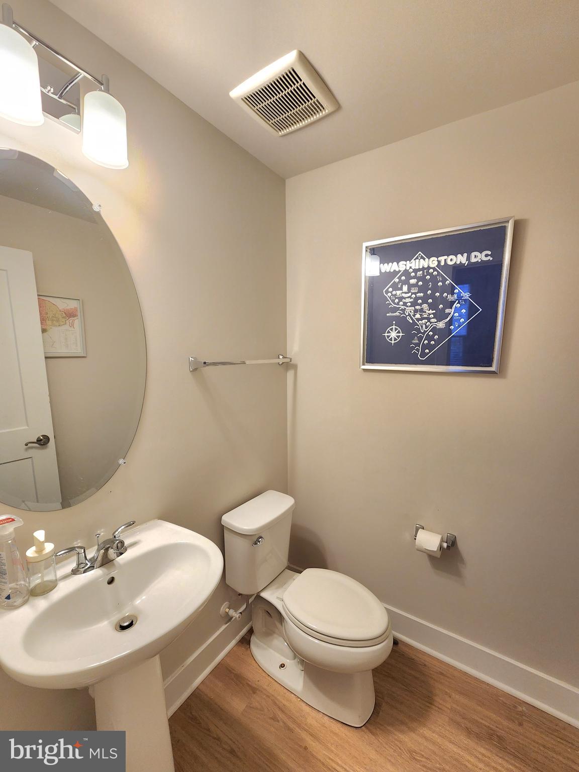 2391 Liberty Loop Herndon, VA 20171 - Photo 21 of 30 a bathroom with a toilet sink and mirror