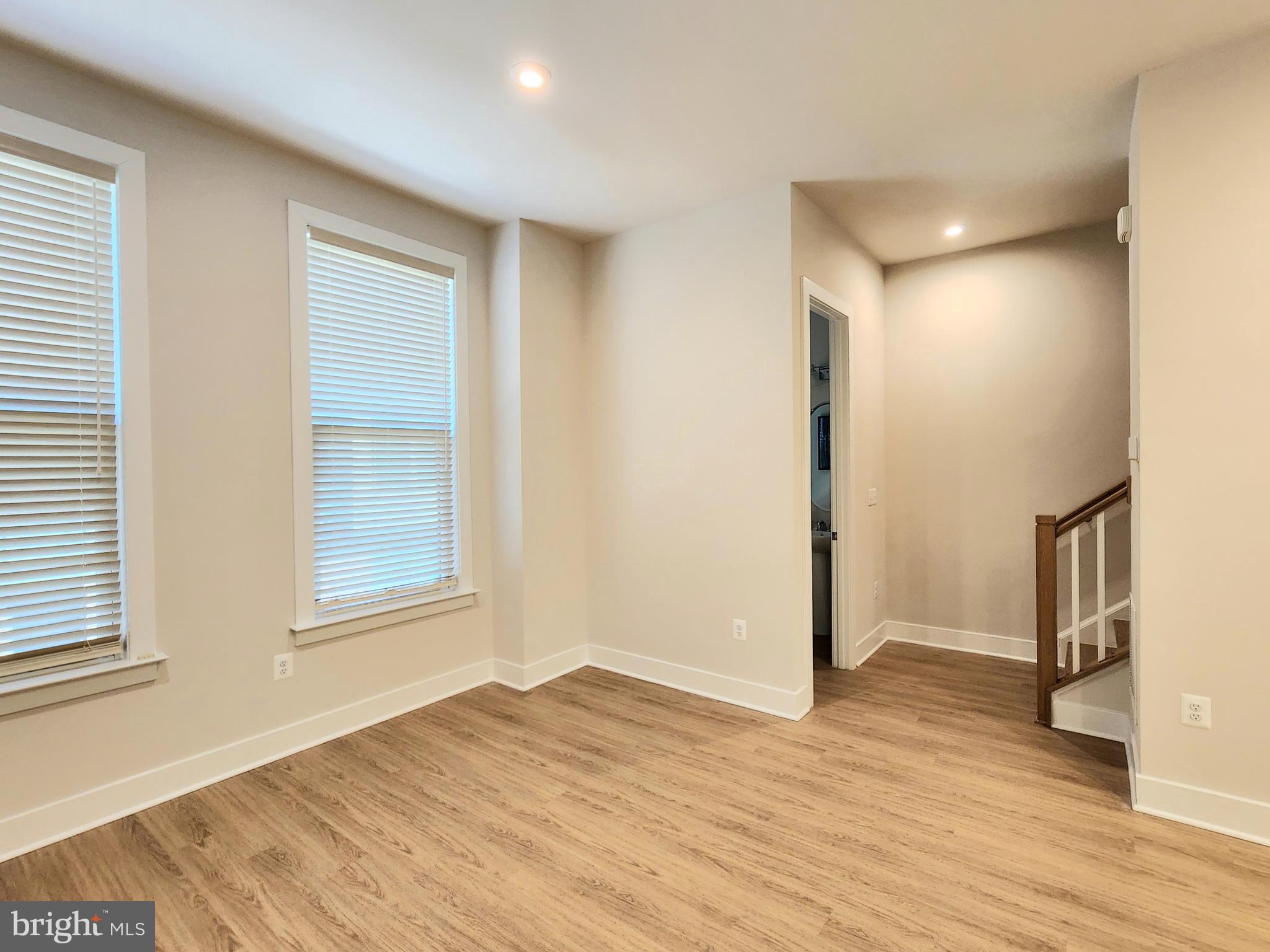 2391 Liberty Loop Herndon, VA 20171 - Photo 22 of 30 a view of empty room with wooden floor and fan
