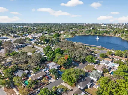 an aerial view of residential building and lake