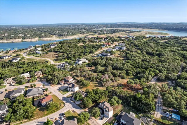an aerial view of residential building and ocean