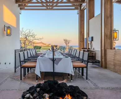 a view of swimming pool with sitting area