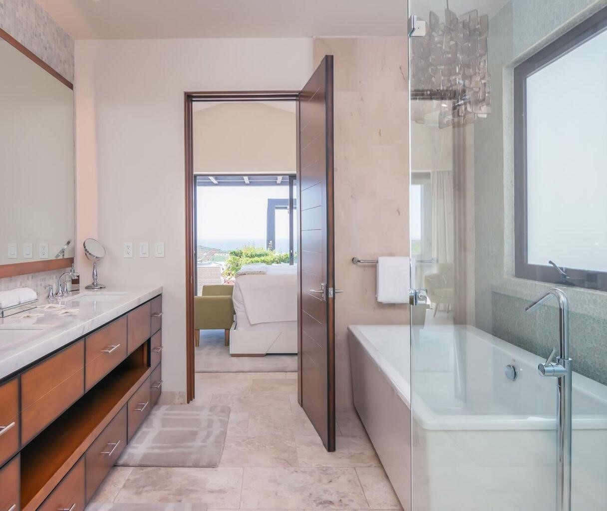 4.3 Coronado undefined, undefined 00000 - Photo 5 of 29 a bathroom with a tub sink and mirror