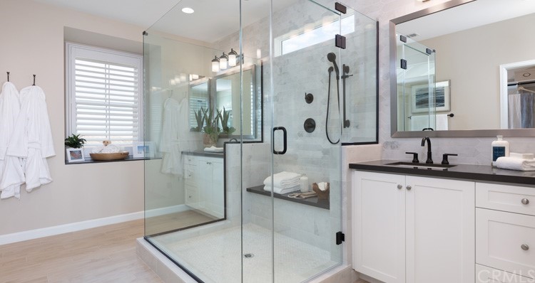 32225 Everview Terrace Temecula, CA 92591 - Photo 4 of 5 a spacious bathroom with a granite countertop sink a mirror and shower