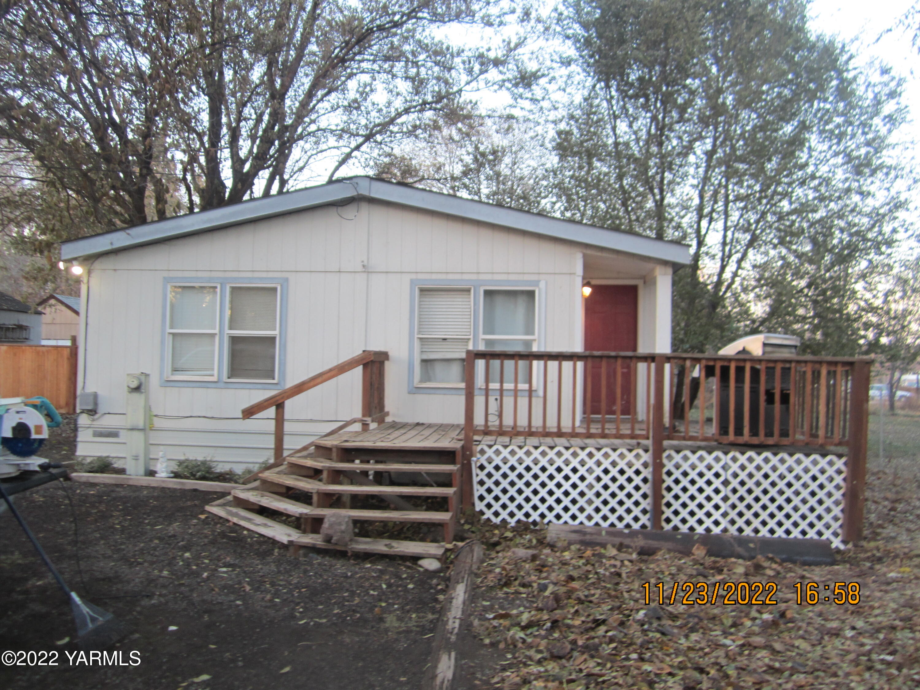2833 Wiley Road Yakima, WA 98903 - Photo 17 of 17 a view of a wooden house with a bench