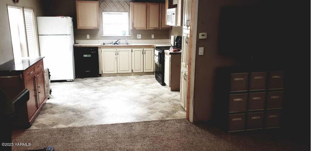 2833 Wiley Road Yakima, WA 98903 - Photo 6 of 17 a view of kitchen with refrigerator and window