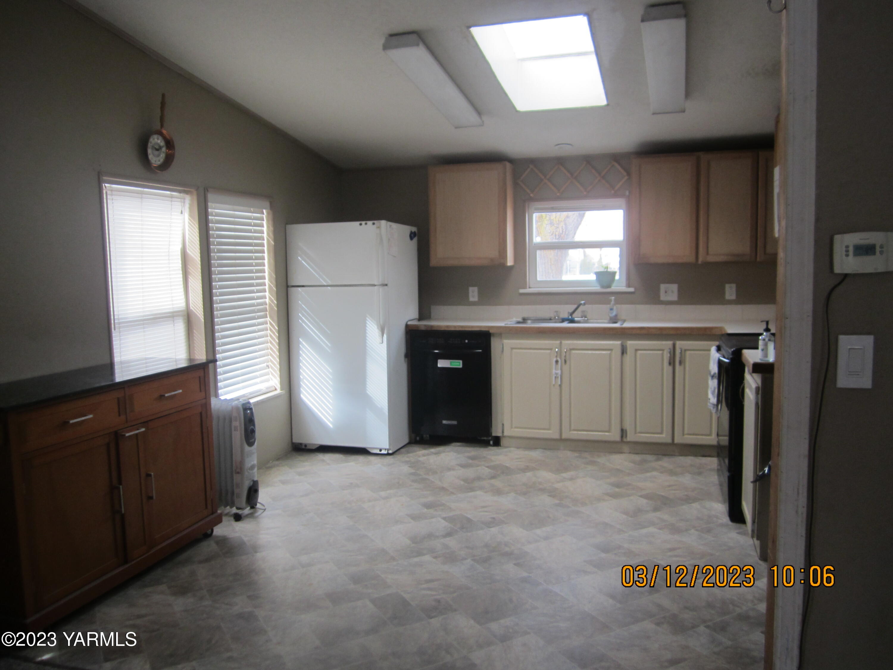 2833 Wiley Road Yakima, WA 98903 - Photo 7 of 17 a kitchen with a sink and refrigerator