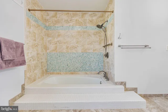 a bathroom with a sink a toilet and a shower