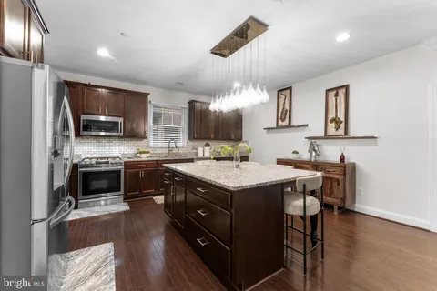 a kitchen with a stove and a sink