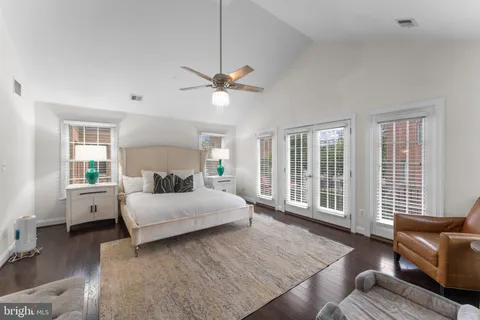 a spacious bedroom with a bed and a couch