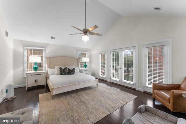 a spacious bedroom with a bed and a couch