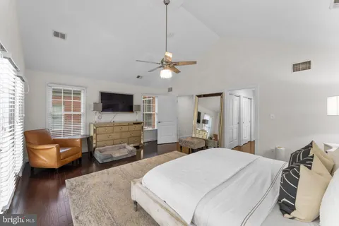 a bedroom with a bed and a couch