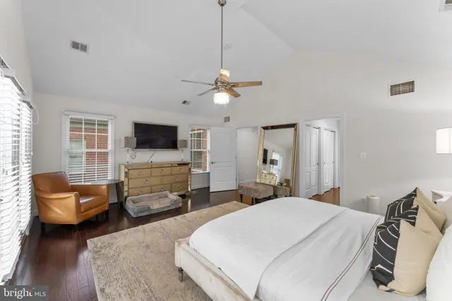 a bedroom with a bed and a couch