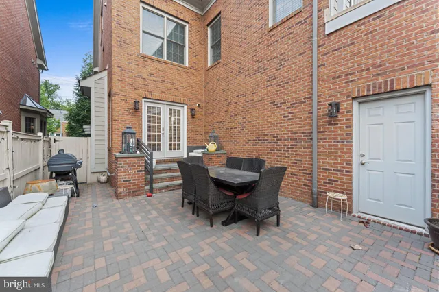 a backyard of a house with outdoor seating