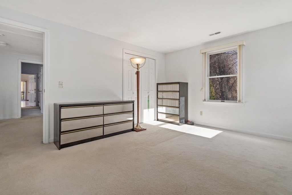 1 Hammersmith Drive Saugus, MA 01906 - Photo 12 of 39 wooden floor in an empty room with a window