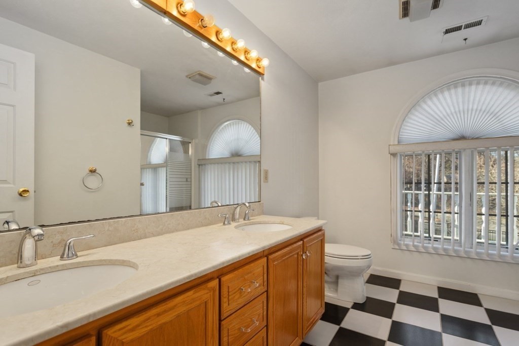 1 Hammersmith Drive Saugus, MA 01906 - Photo 15 of 39 a spacious bathroom with a double vanity sink mirror and toilet