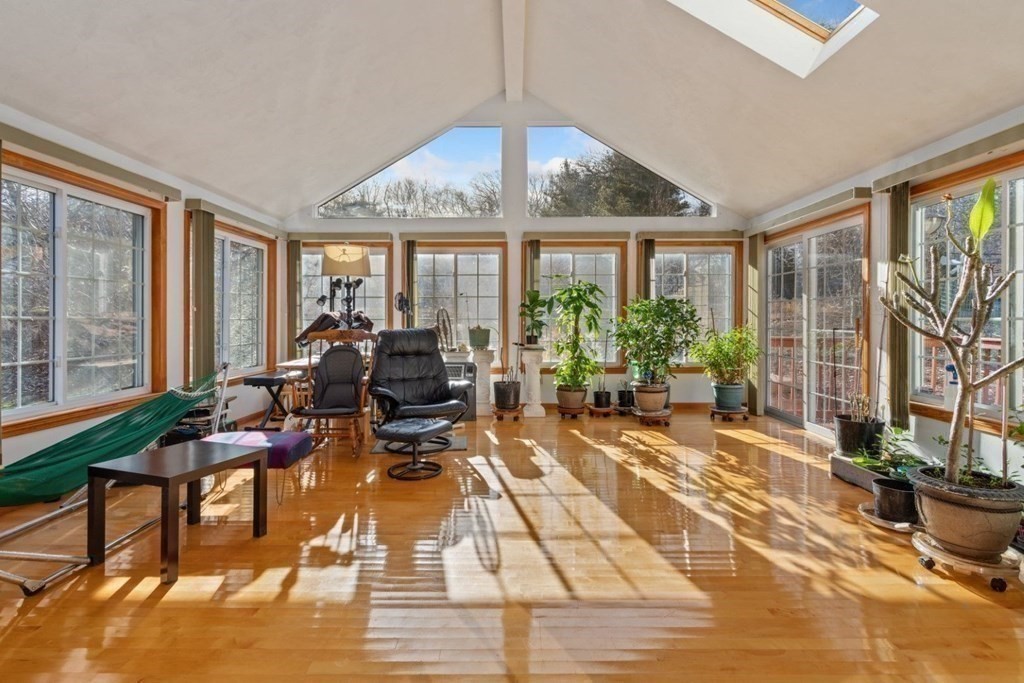 1 Hammersmith Drive Saugus, MA 01906 - Photo 18 of 39 a living room with patio furniture and a potted plant