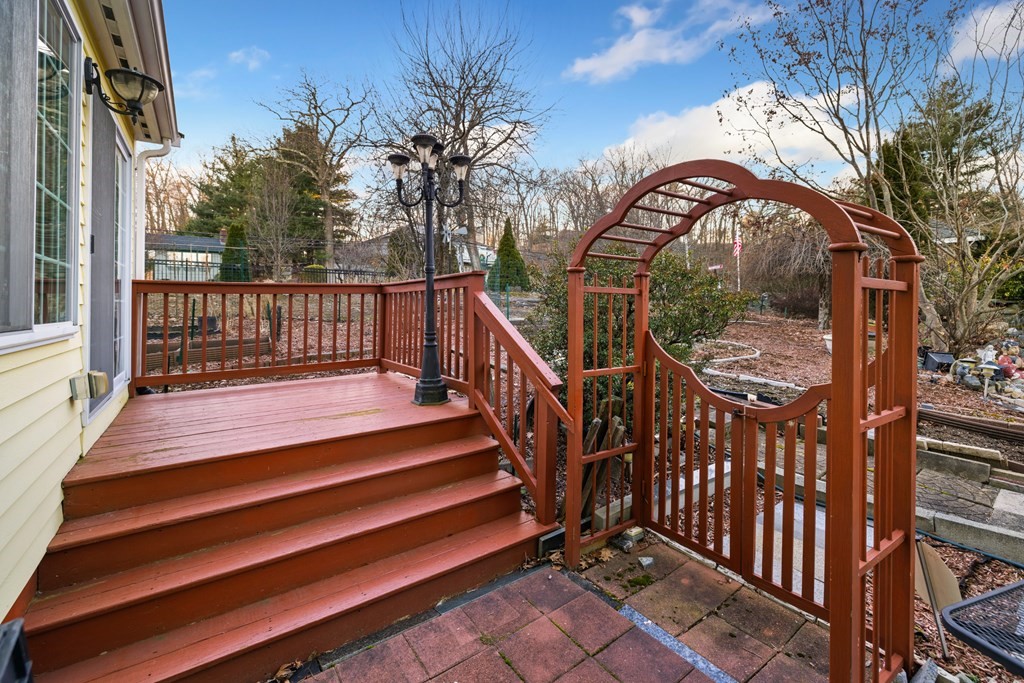 1 Hammersmith Drive Saugus, MA 01906 - Photo 31 of 39 a view of a house with backyard and deck