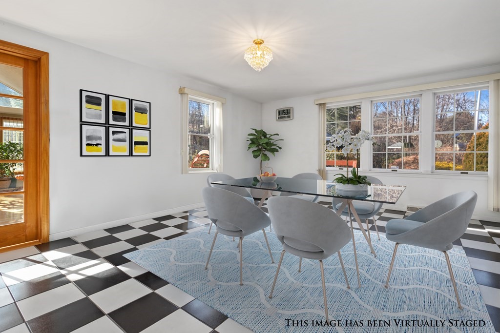 1 Hammersmith Drive Saugus, MA 01906 - Photo 33 of 39 a dining room with a table and chairs