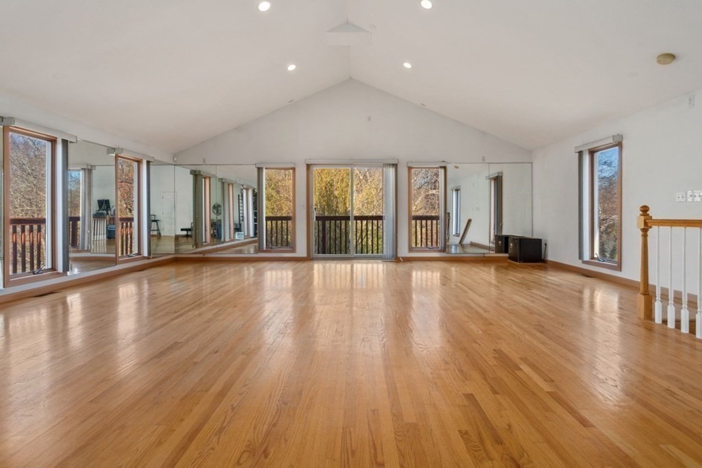 1 Hammersmith Drive Saugus, MA 01906 - Photo 5 of 39 a view of an empty room with wooden floor and a window