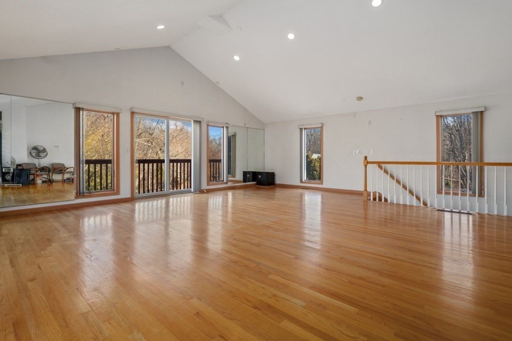 1 Hammersmith Drive Saugus, MA 01906 - Photo 6 of 39 a view of an empty room with wooden floor and a large window