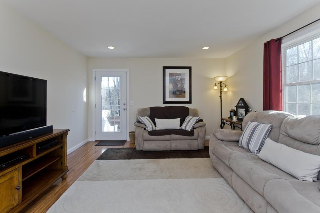 445 Monson Road Wilbraham, MA 01095 - Photo 19 of 42 a living room with furniture and a flat screen tv