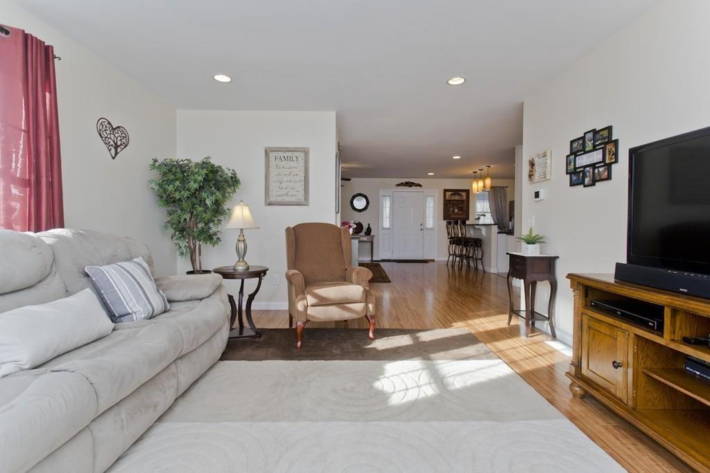 445 Monson Road Wilbraham, MA 01095 - Photo 21 of 42 a living room with furniture and a flat screen tv
