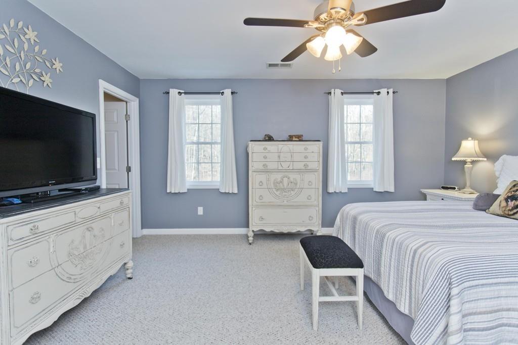 445 Monson Road Wilbraham, MA 01095 - Photo 27 of 42 a bedroom with furniture and flat screen tv