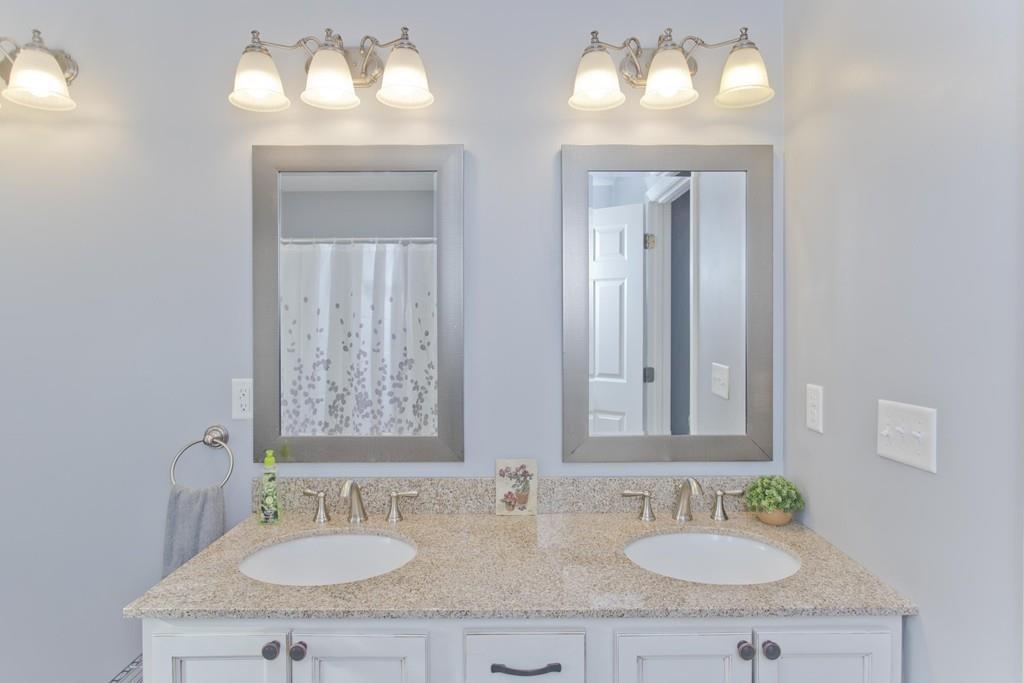 445 Monson Road Wilbraham, MA 01095 - Photo 31 of 42 a bathroom with double vanity sinks and a mirror