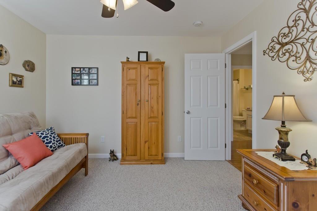 445 Monson Road Wilbraham, MA 01095 - Photo 35 of 42 a bedroom with bed and a couch
