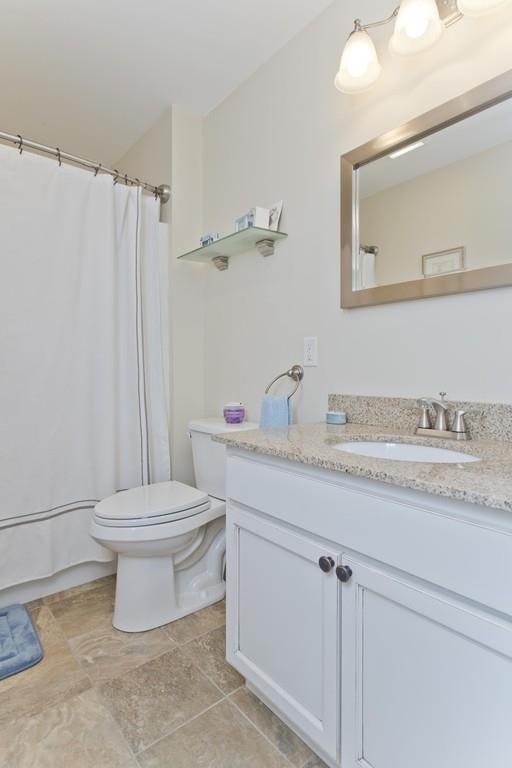 445 Monson Road Wilbraham, MA 01095 - Photo 36 of 42 a bathroom with a granite countertop sink toilet and shower