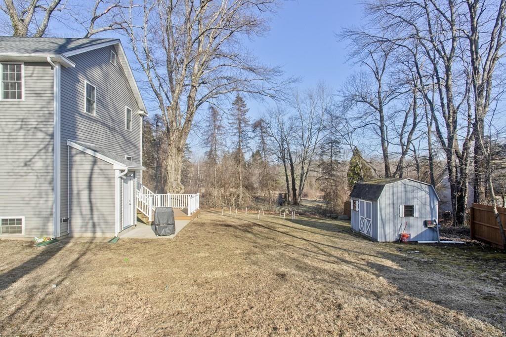 445 Monson Road Wilbraham, MA 01095 - Photo 41 of 42 a view of a house with a yard covered in snow