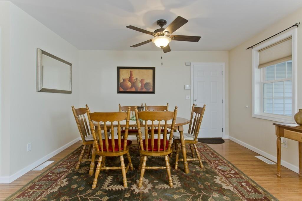 445 Monson Road Wilbraham, MA 01095 - Photo 7 of 42 a view of a dining room with furniture and a chandelier