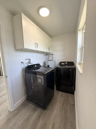 a utility room with washer and dryer