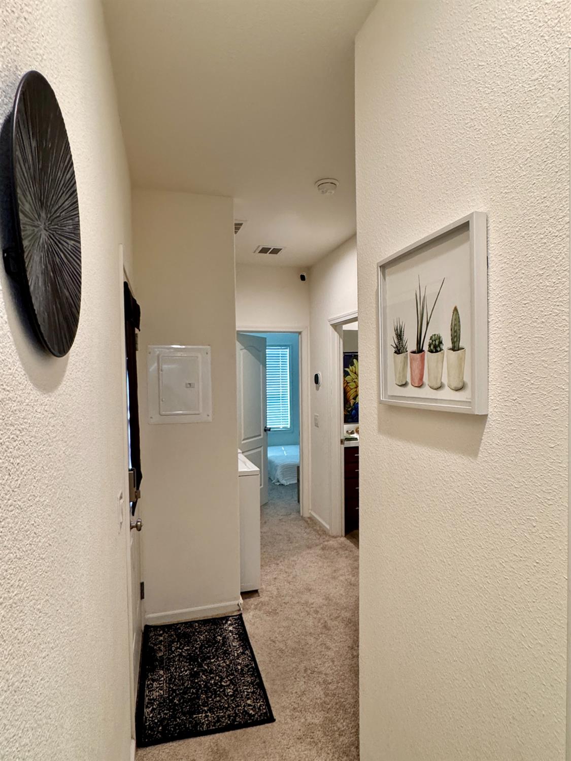 360 East Grant Line Road, Unit 16 Tracy, CA 95376 - Photo 17 of 36 Interior hallway featuring textured walls and carpet flooring