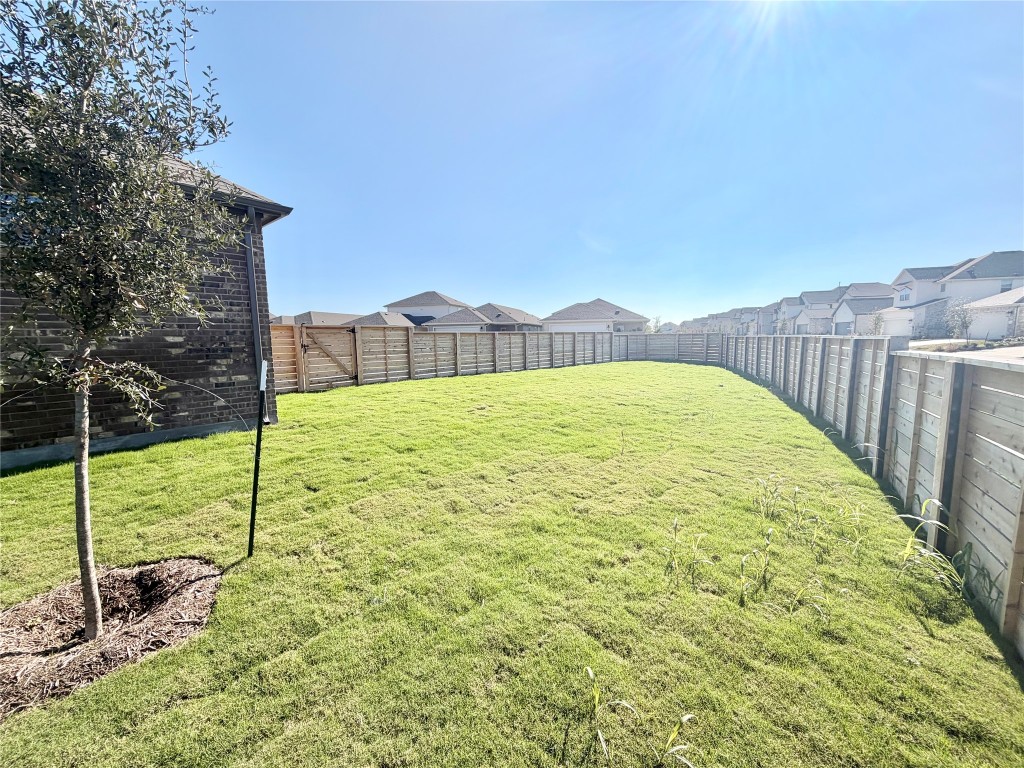500 Bloomington Loop Hutto, TX 78634 - Photo 15 of 18 a view of an outdoor space and a yard