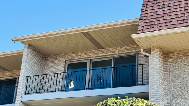 a view of a yard with yellow house