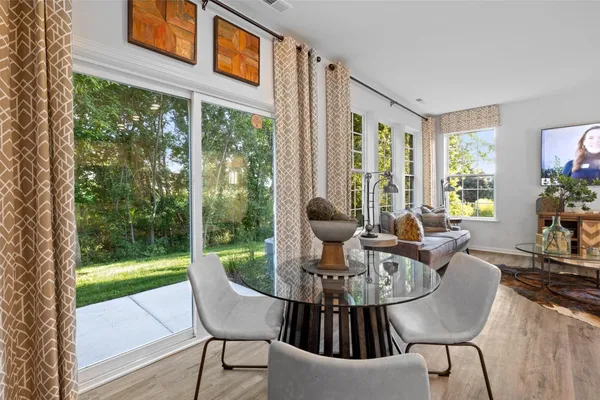 a view of a dining room with furniture window and outside view