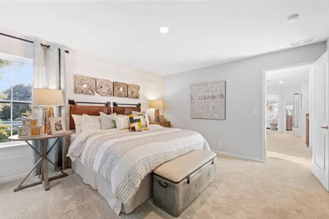 a bedroom with a bed and a table