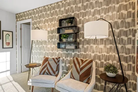 a dining room with furniture and window