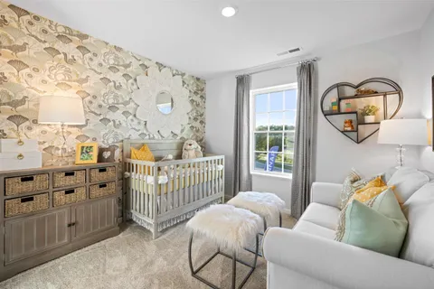 a bedroom with furniture and wooden floor