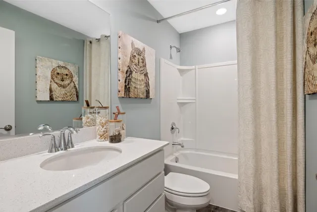 a view of a storage & utility room with refrigerator