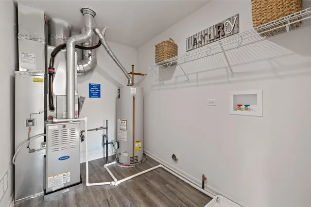 a view of a patio with couches chairs potted plants and floor to ceiling window