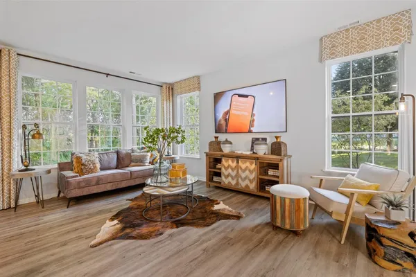 a living room with furniture and a large window