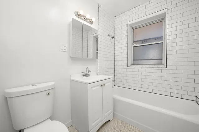 a bathroom with a sink toilet and bathtub