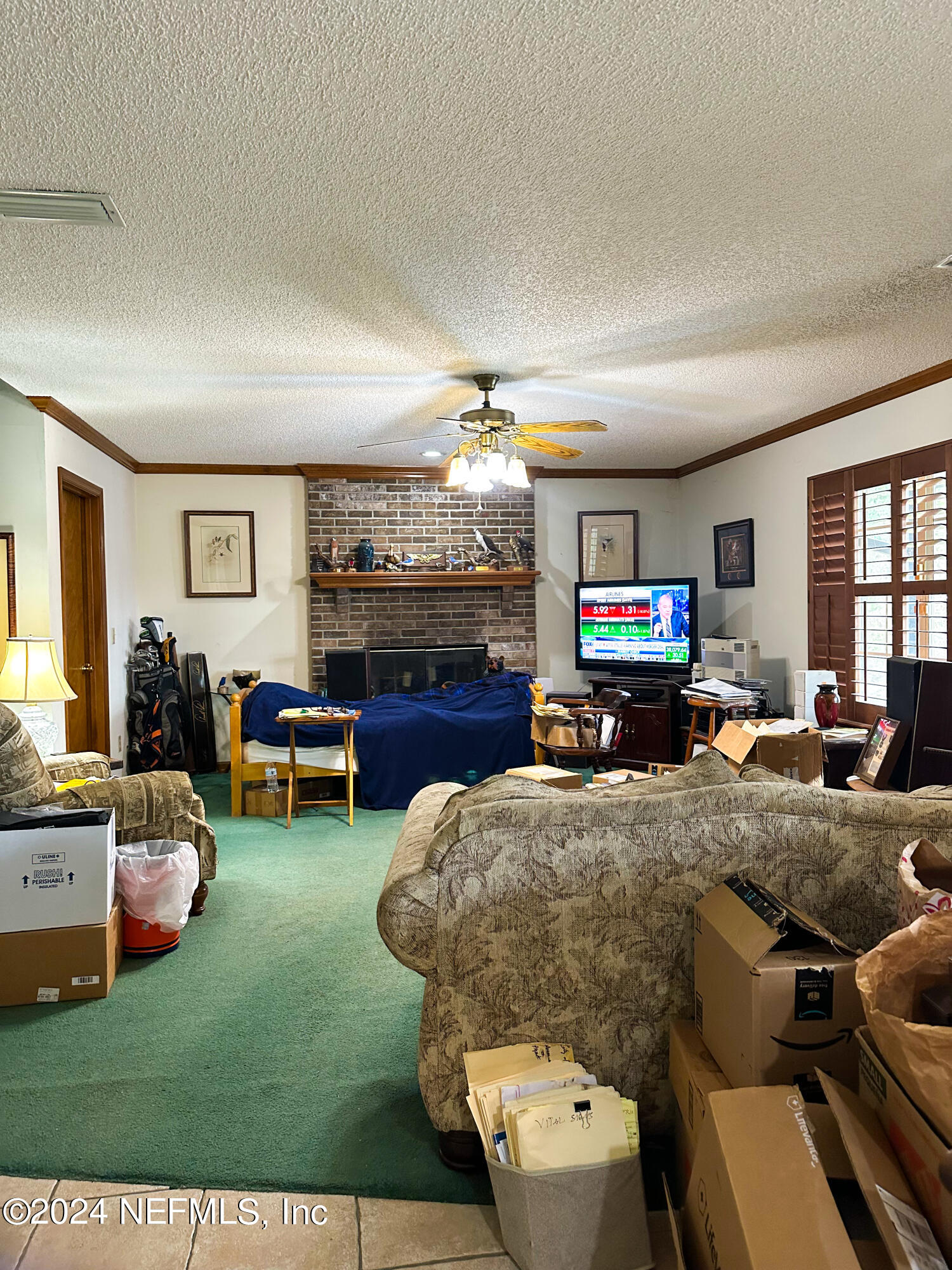 10601 Quail Ridge Drive Ponte Vedra, FL 32081 - Photo 17 of 17 a living room with furniture and a flat screen tv