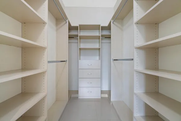 a view of an empty walk in closet