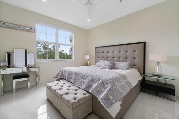 a bedroom with a bed and a couch