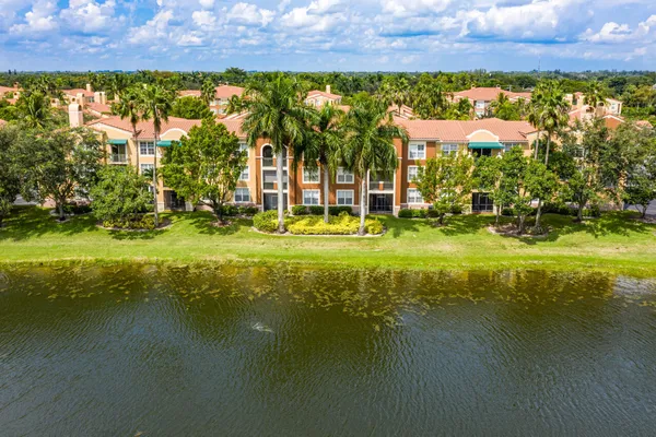 a view of a building with a lake