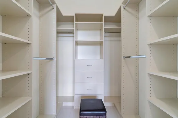 a view of an empty walk in closet